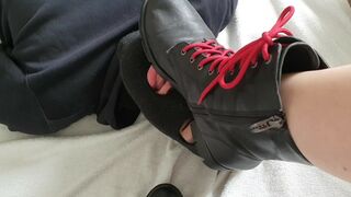 Know your place! Dog uses tongue to clean goddess boots.