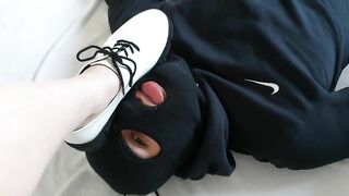 Slave licks shoes clean