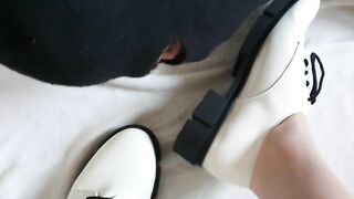 Slave licks shoes clean